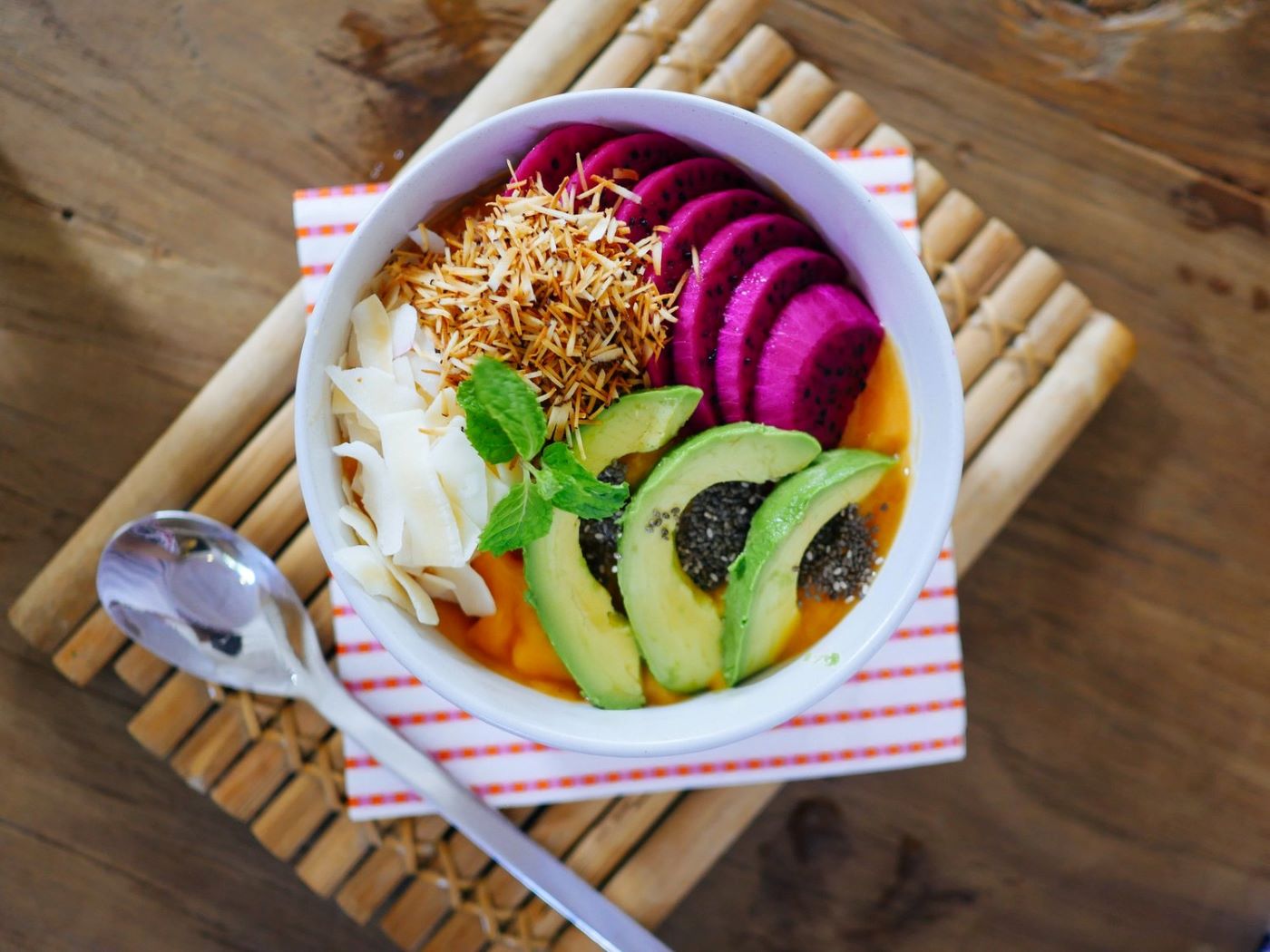Smoothie bowl with avocado, coconut, and fruit