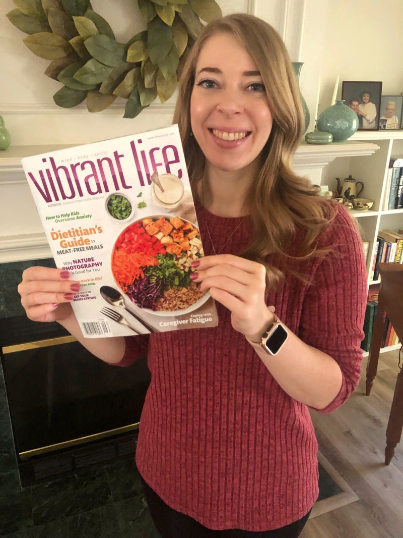 Stephanie Wells, MS, RD, LD with copy of Vibrant Life magazine
